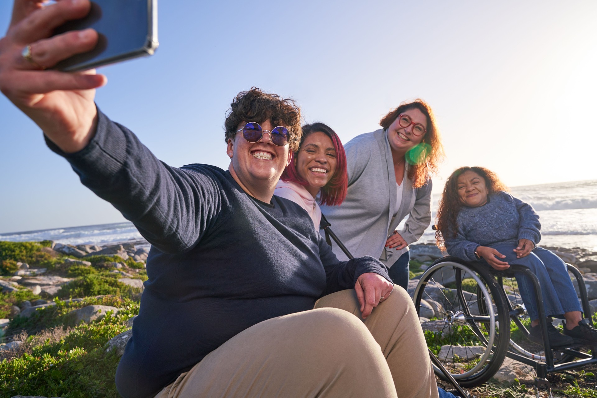 Disabled friends taking selfie outdoors